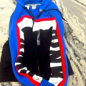 Brand new with tags never tried on size medium pink hoodie